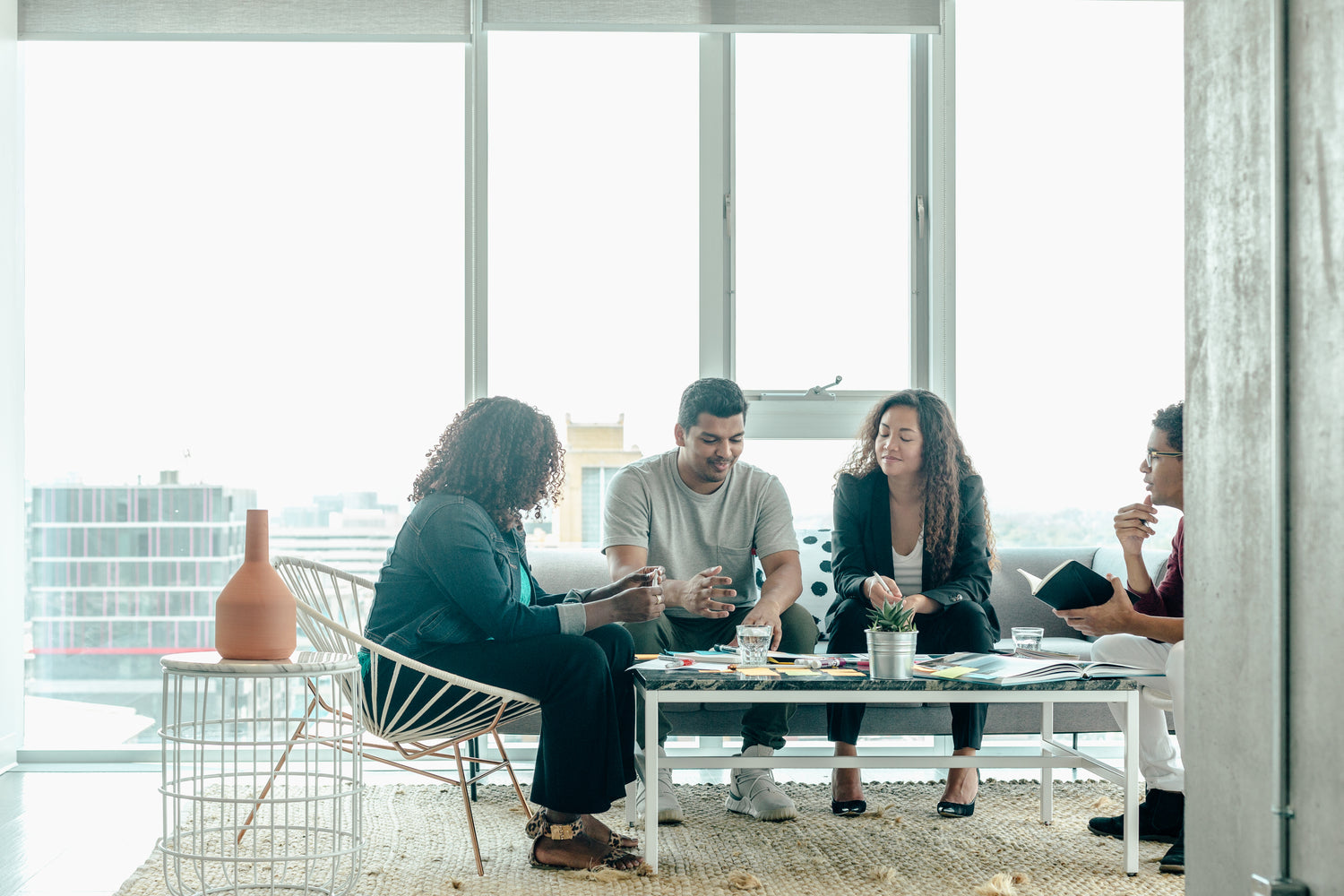 team brainstorm meeting in modern office lounge space